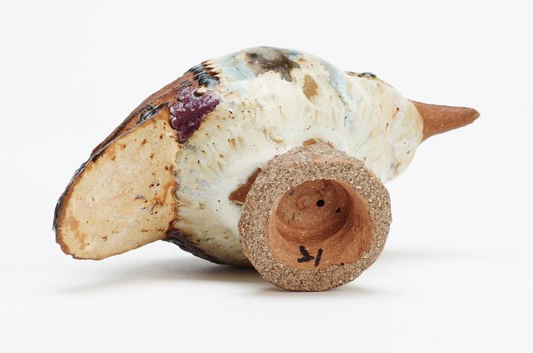 A Tyra Lundgren stoneware bird, signed with a seal.