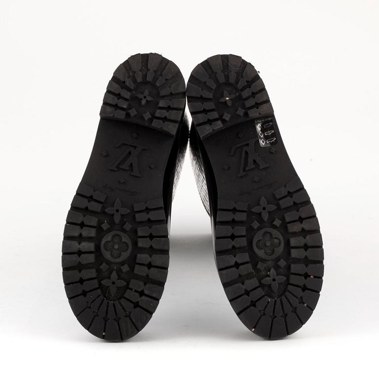 LOUIS VUITTON, a pair of rain boots. Size 36.