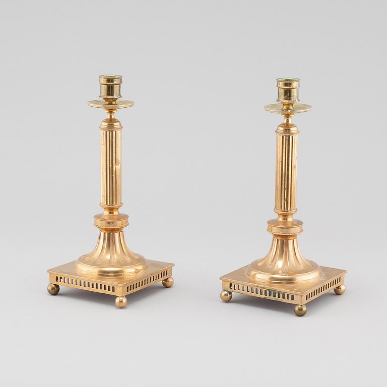 A pair of gustavian style brass candle sticks by Grillby Metal factory, Sweden, first half of the 20th century.