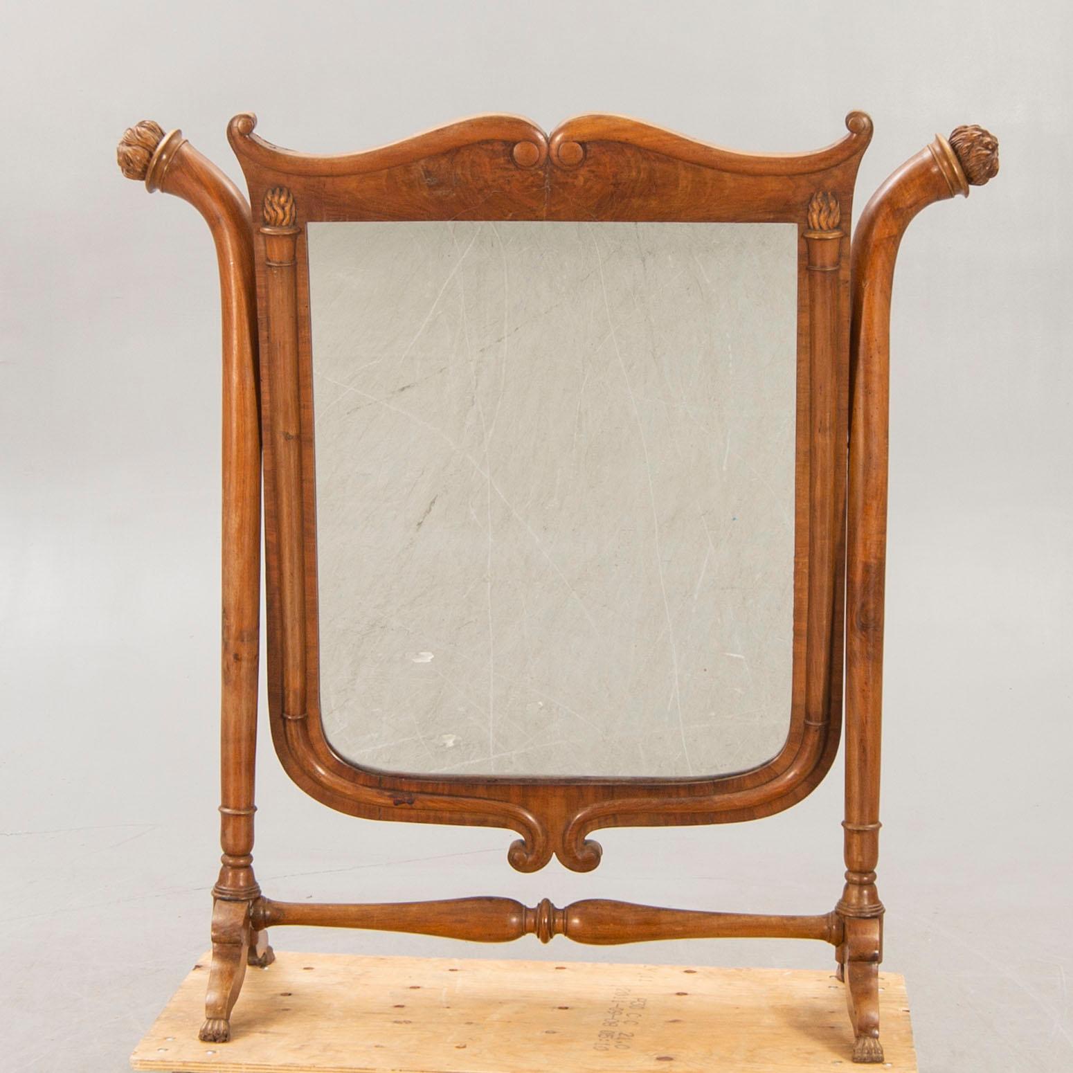 A late 19th century walnut floor mirror.