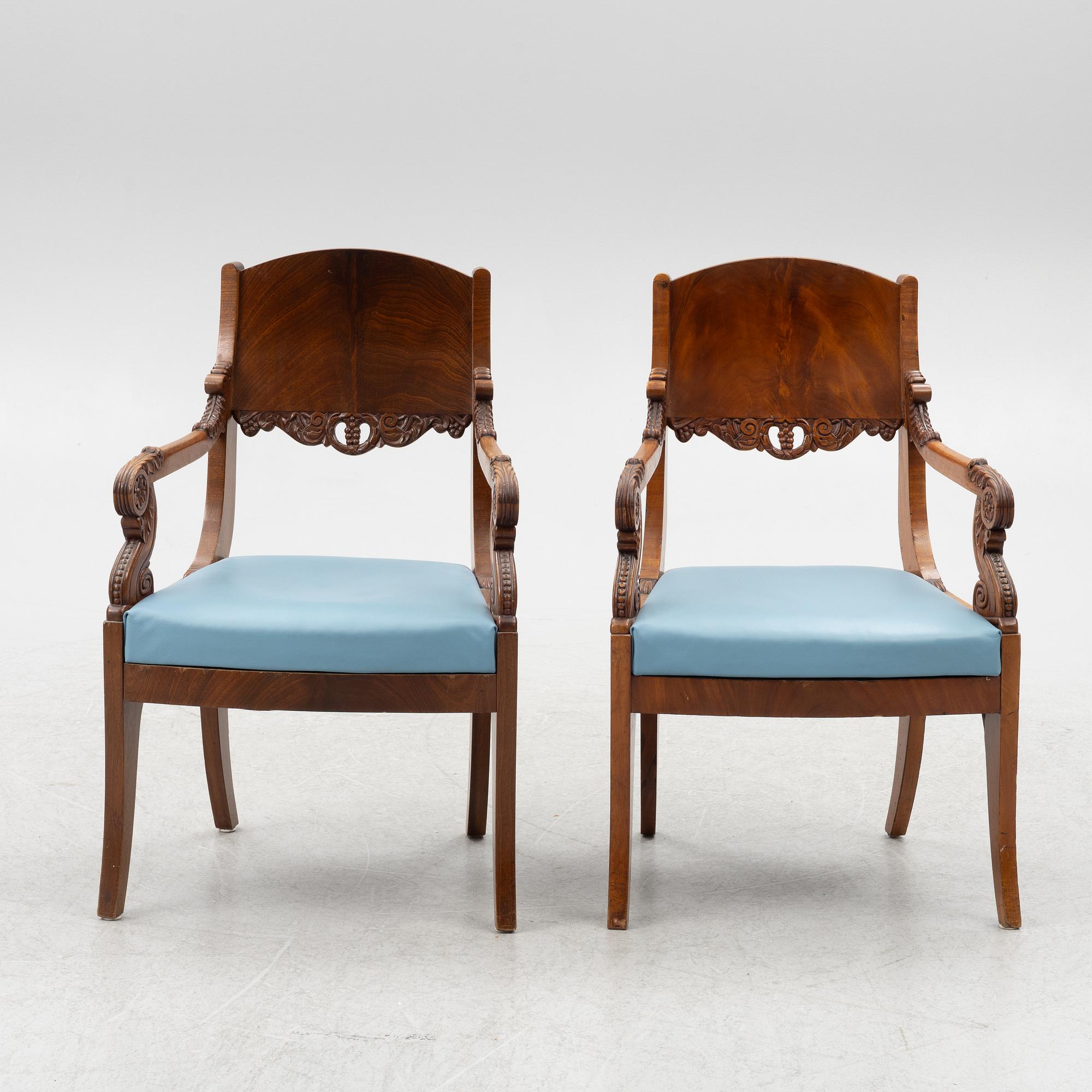 A pair of Baltic late Empire mahogany open armchairs, ca 1840.