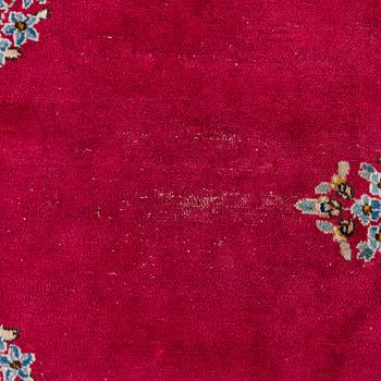 A Kirman carpet, signed, c. 388 x 279 cm.