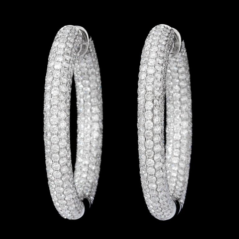 A pair of diamond, 8.52 cts in total, hoop earrings.