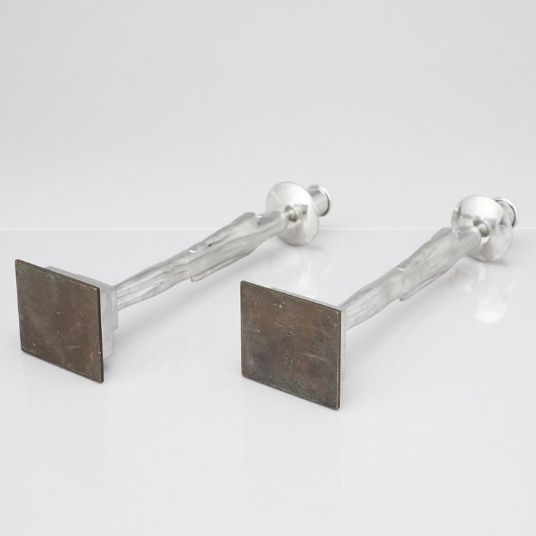 Edvin Öhrström, a pair of pewter and brass 'Egyptian' candlesticks, Svenskt Tenn, Sweden 1984.