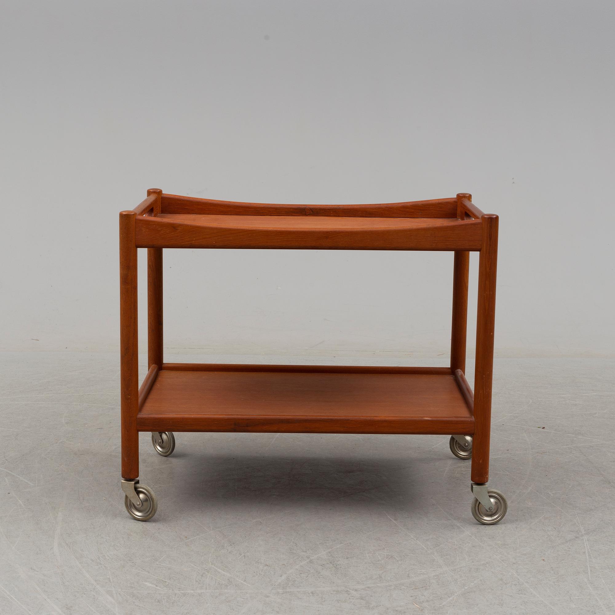 A mid 20th century teak serving trolley by Hans J Wegner, Andr. Tuck, Denmark.