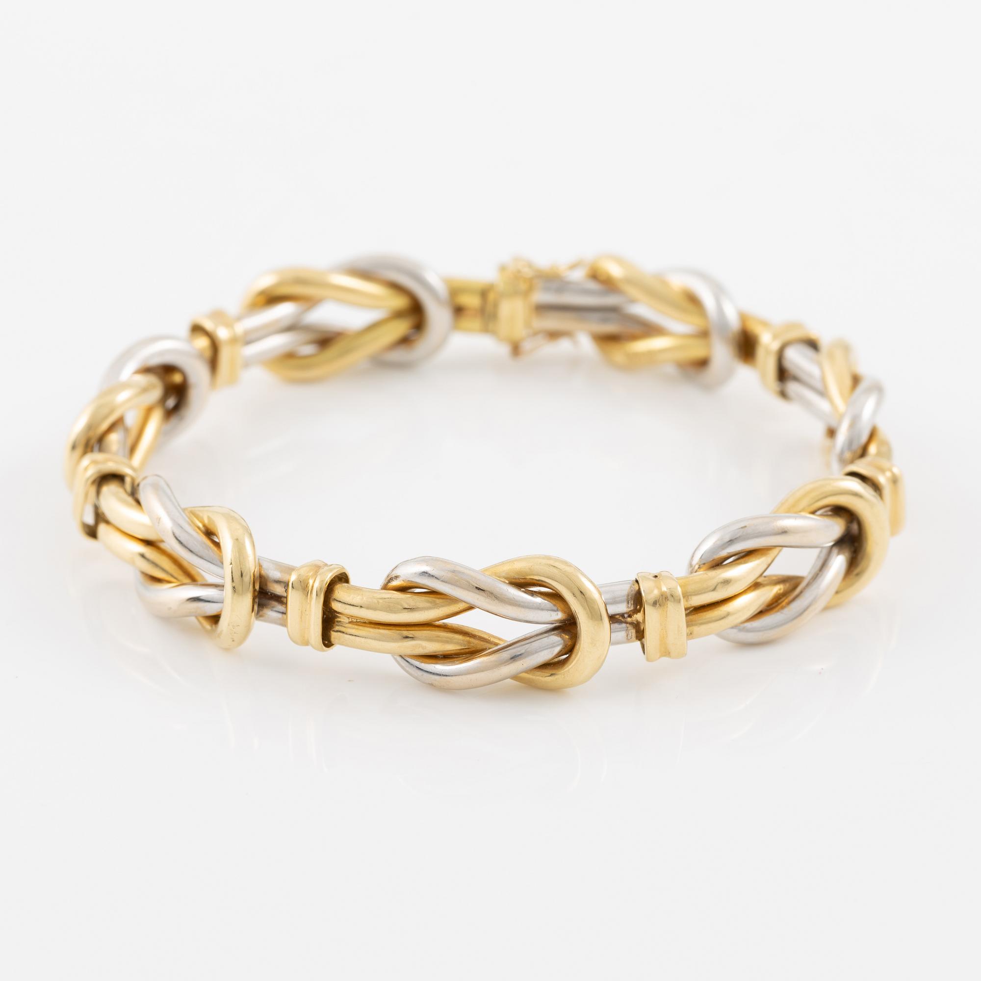 A bracelet in 18K gold and white gold.