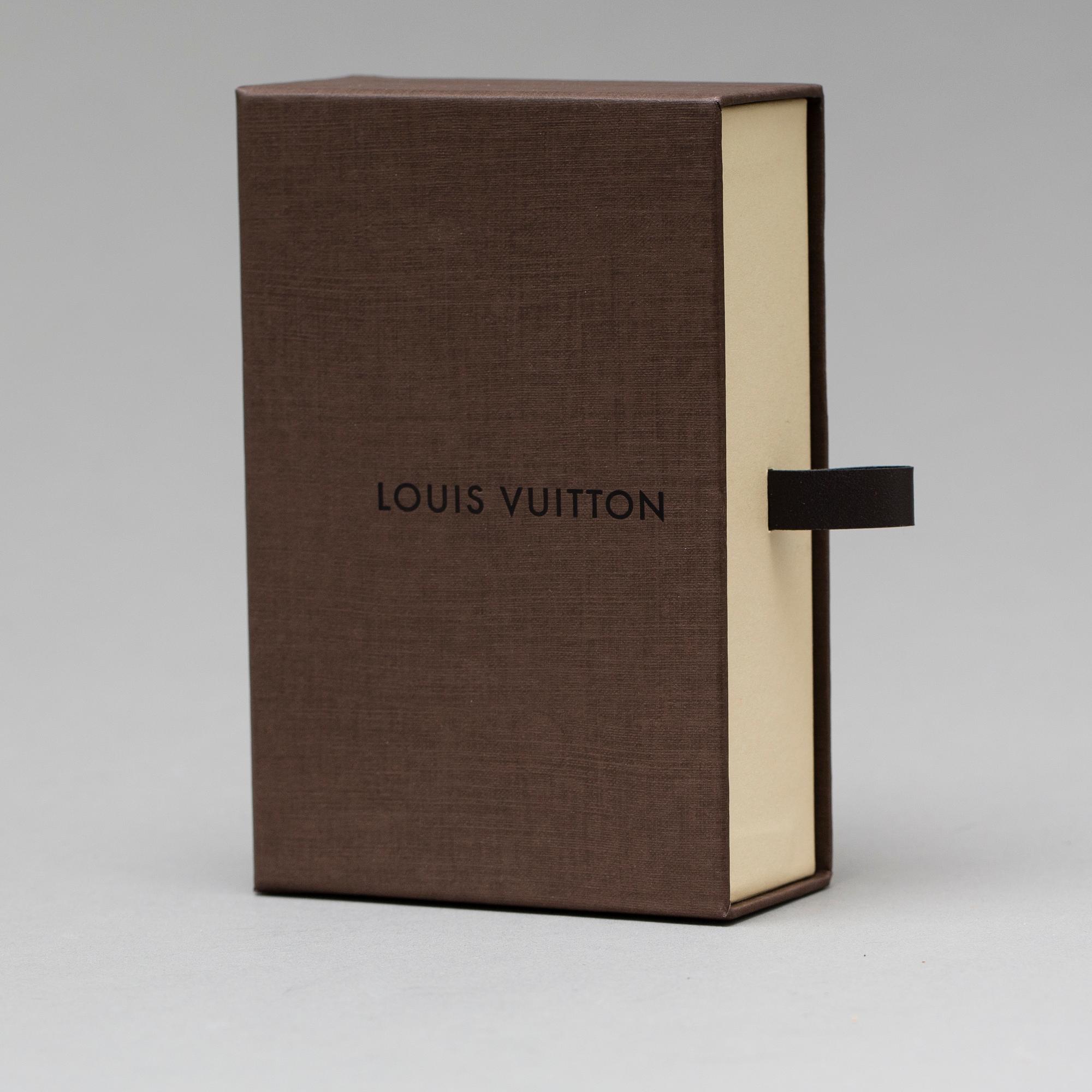 A Louis Vuitton "Digit" bracelet.