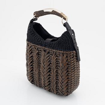 Yves Saint Laurent, a rattan and horn handbag.