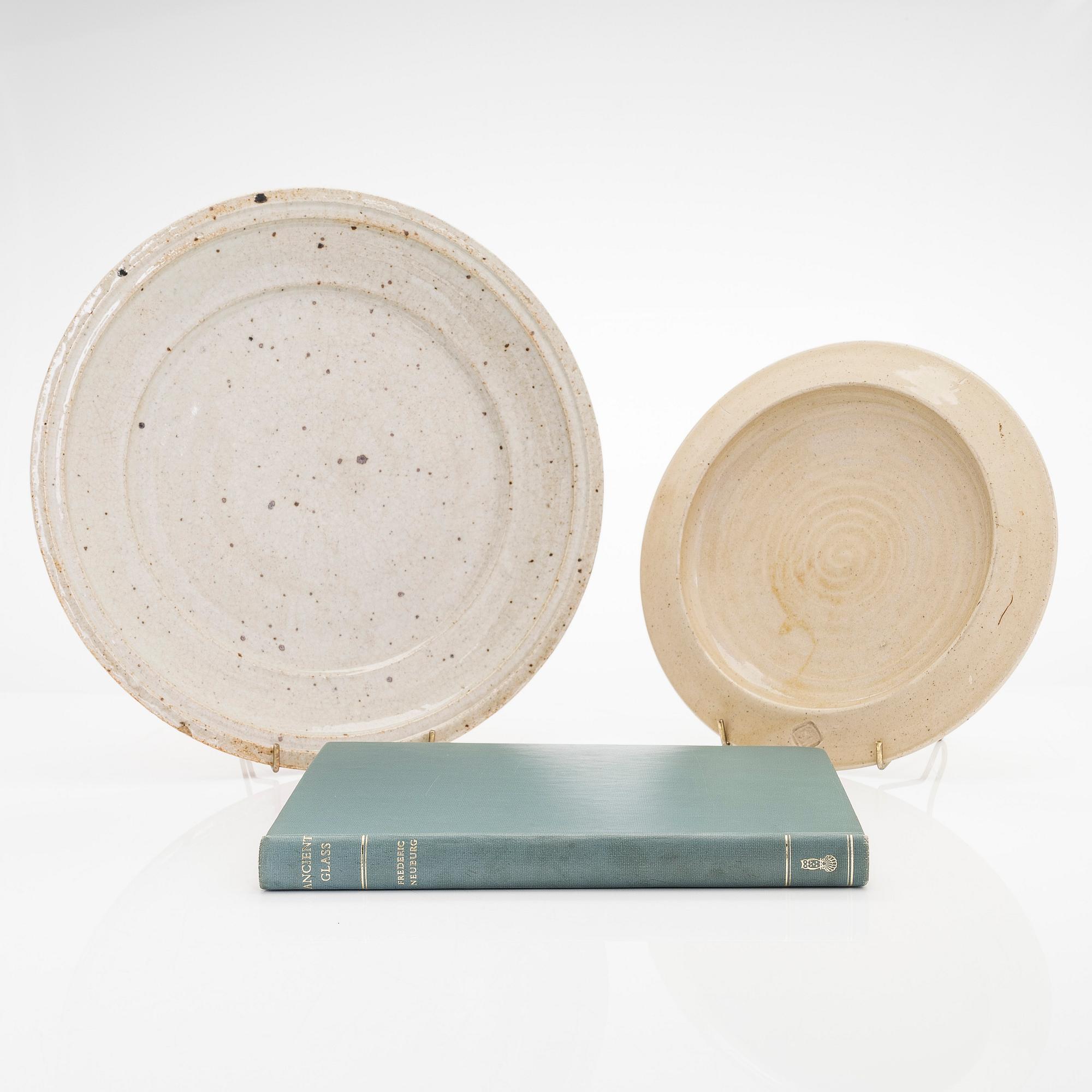 Kyllikki Salmenhaara, two stoneware plates signed KS and a book signed by Kyllikki Salmenhaara.