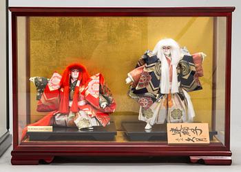 Four late 20th century Japanese dolls.