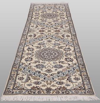 A Nain part silk runner carpet, 311 x 88 cm.