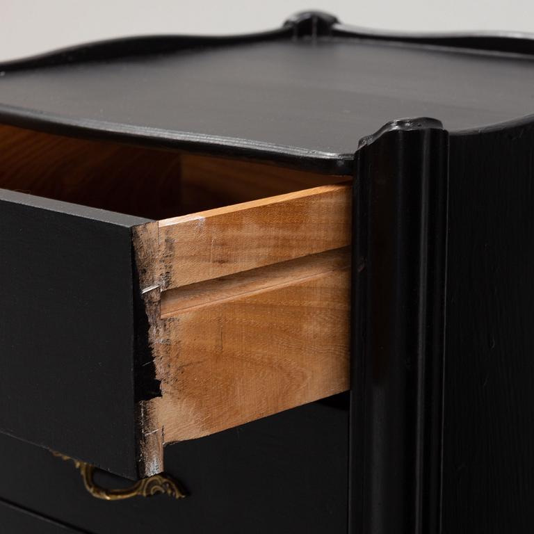 A pair of painted rococo-style bedside tables, later part of the 20th Century.