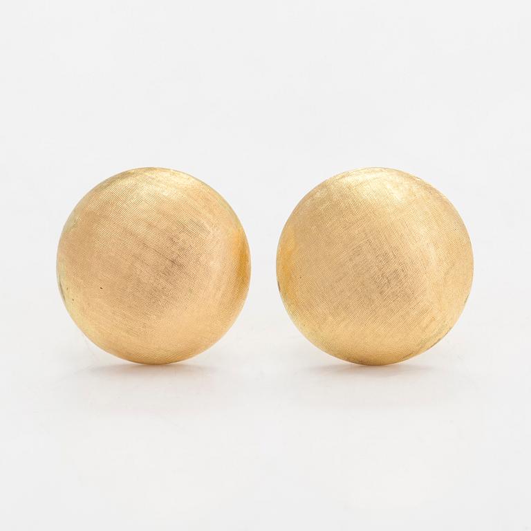 A pair of 18K gold earrings.