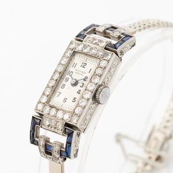 Ladies’ wristwatch in platinum and 18K white gold with old-cut diamonds and sapphires, Art Deco.