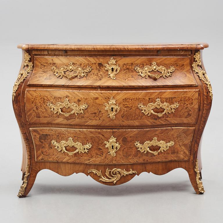 A burr-alder and gilt brass-mounted rococo commode by J. Sjölin (master 1767-1785).