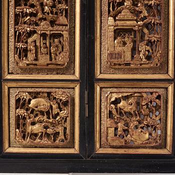 A set of four framed wooden panels, Qing dynasty, 19th Century.