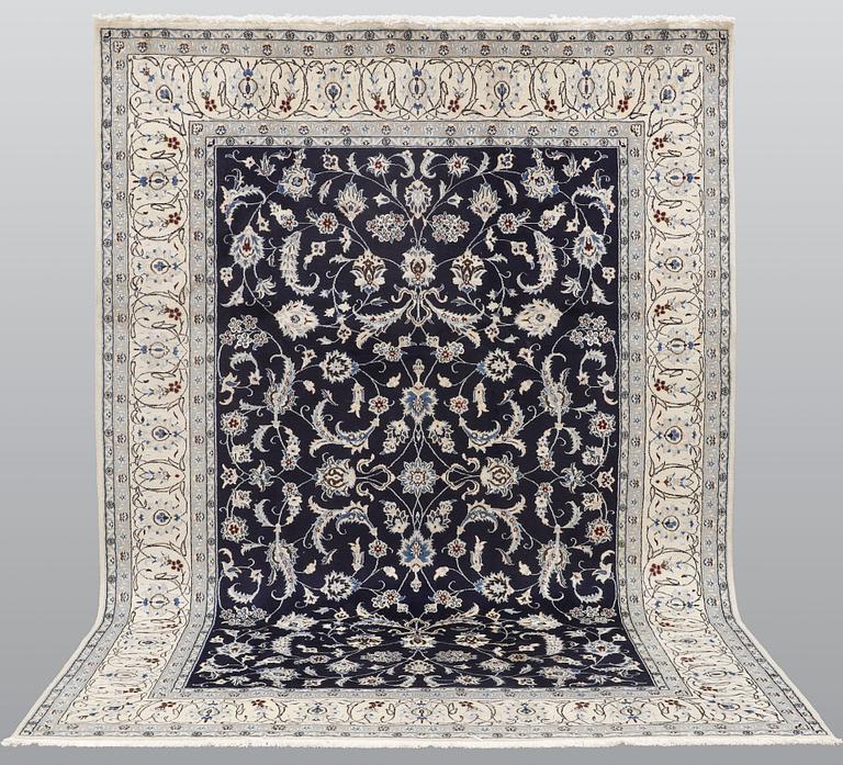 A carpet, Nain, part silk, ca 350 x 247 cm.