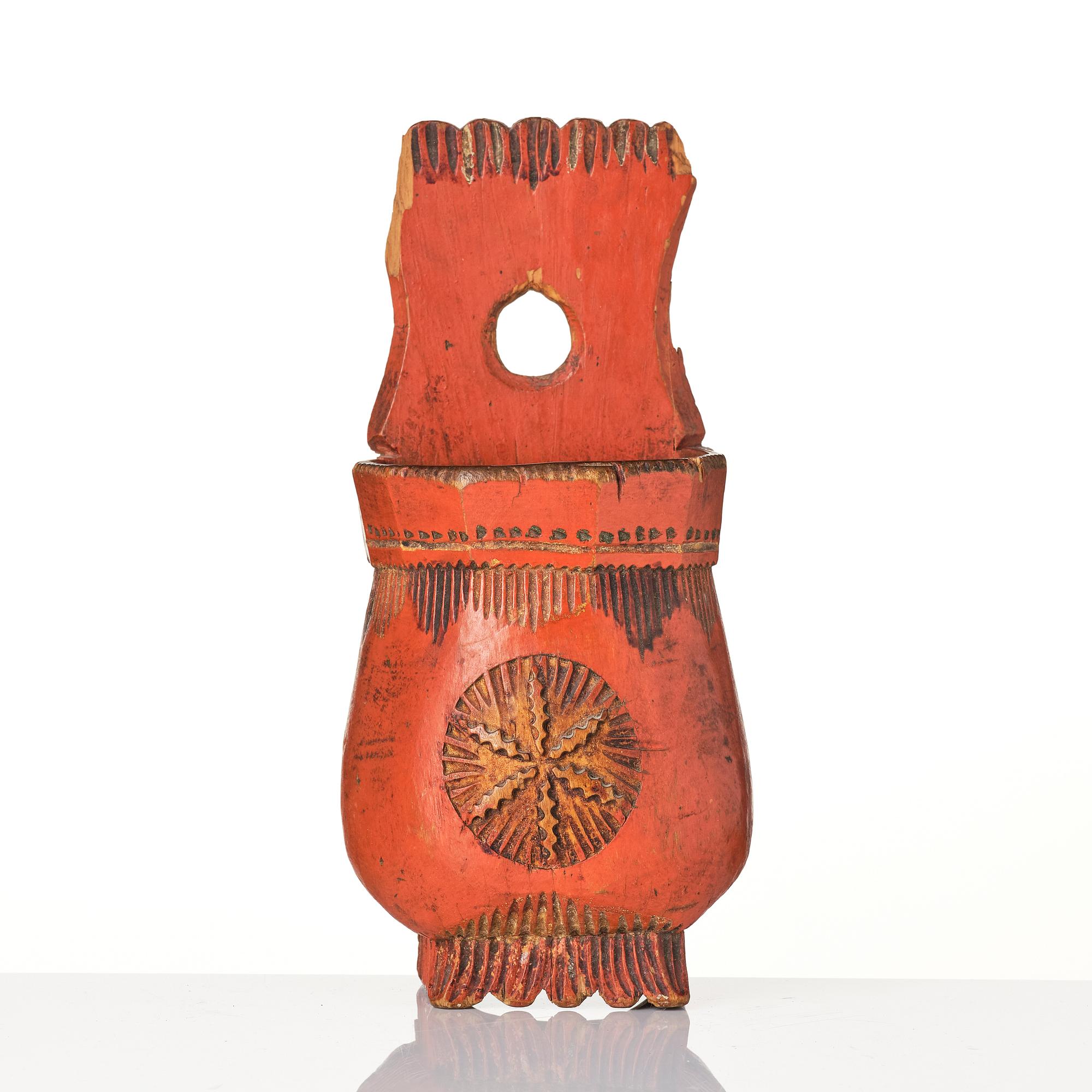 A Swedish folk art carved and painted spoon holder, 18th century.