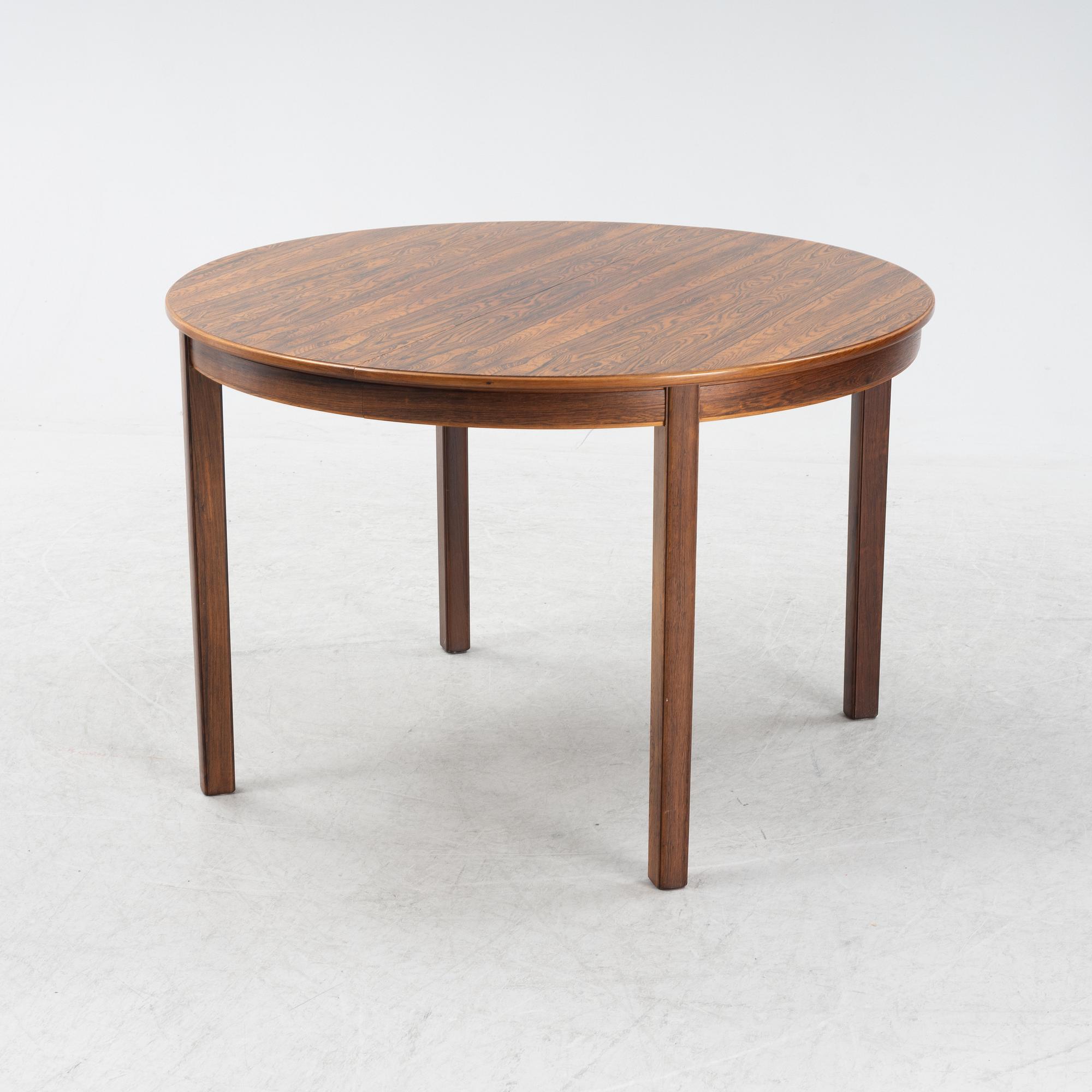 A 1960's/70's rosewood veneered dining group.