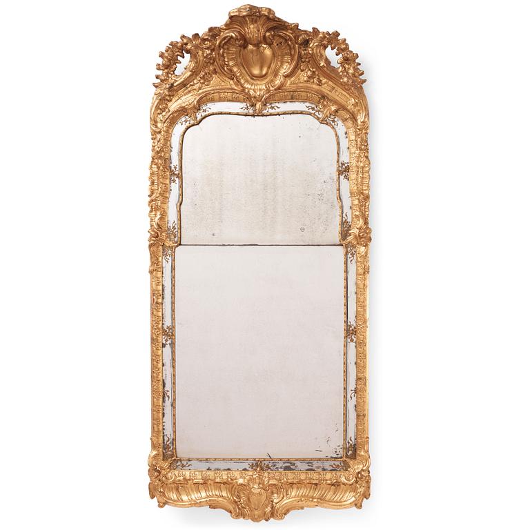 A Swedish rococo carved giltwood and gesso mirror, later part of the 18th century.