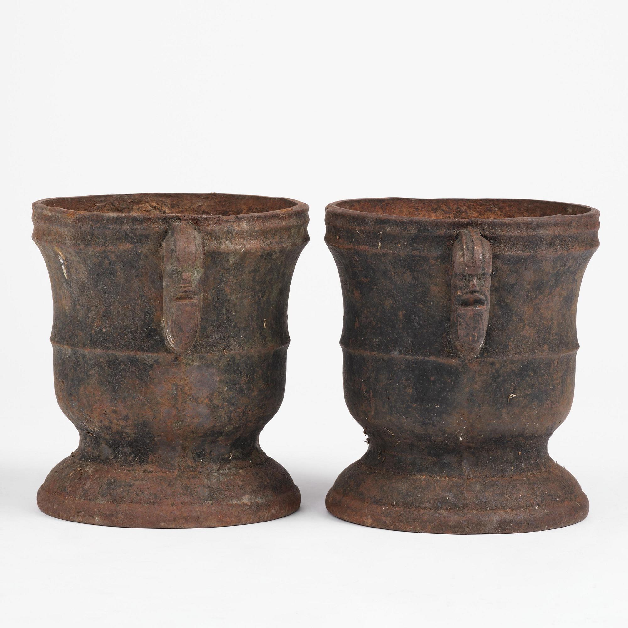 A pair of Swedish cast-iron garden urns, 18th century.