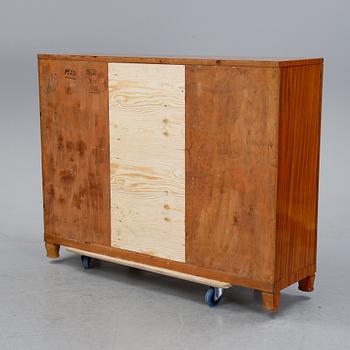 A 1940's Swedish Modern mahogany veneered cabinet.