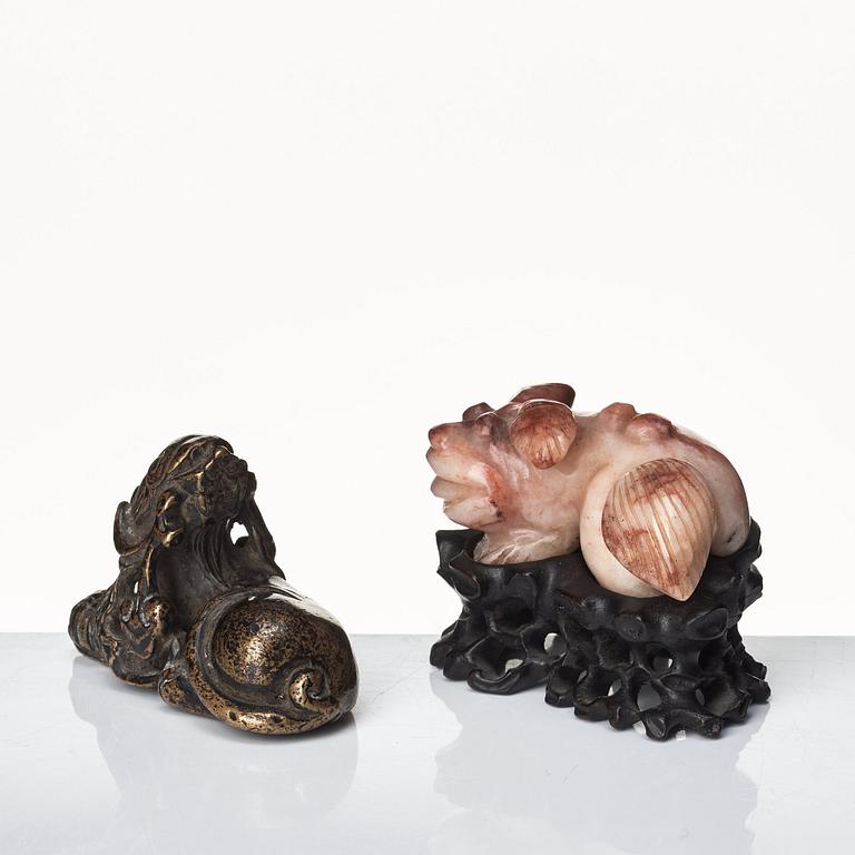 Two sculptures of reclining dogs, Qing dynasty.