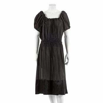 633. DKNY, a black silk dress. Size M.