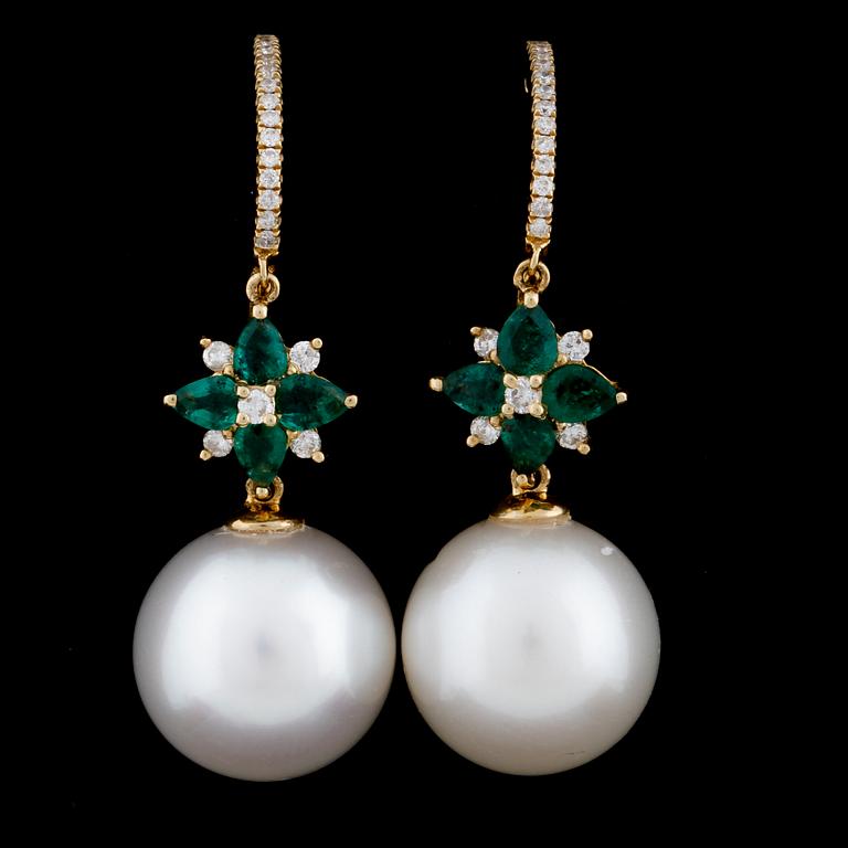 A pair of cultured pearl, emerald and brilliant cut diamond earrings.