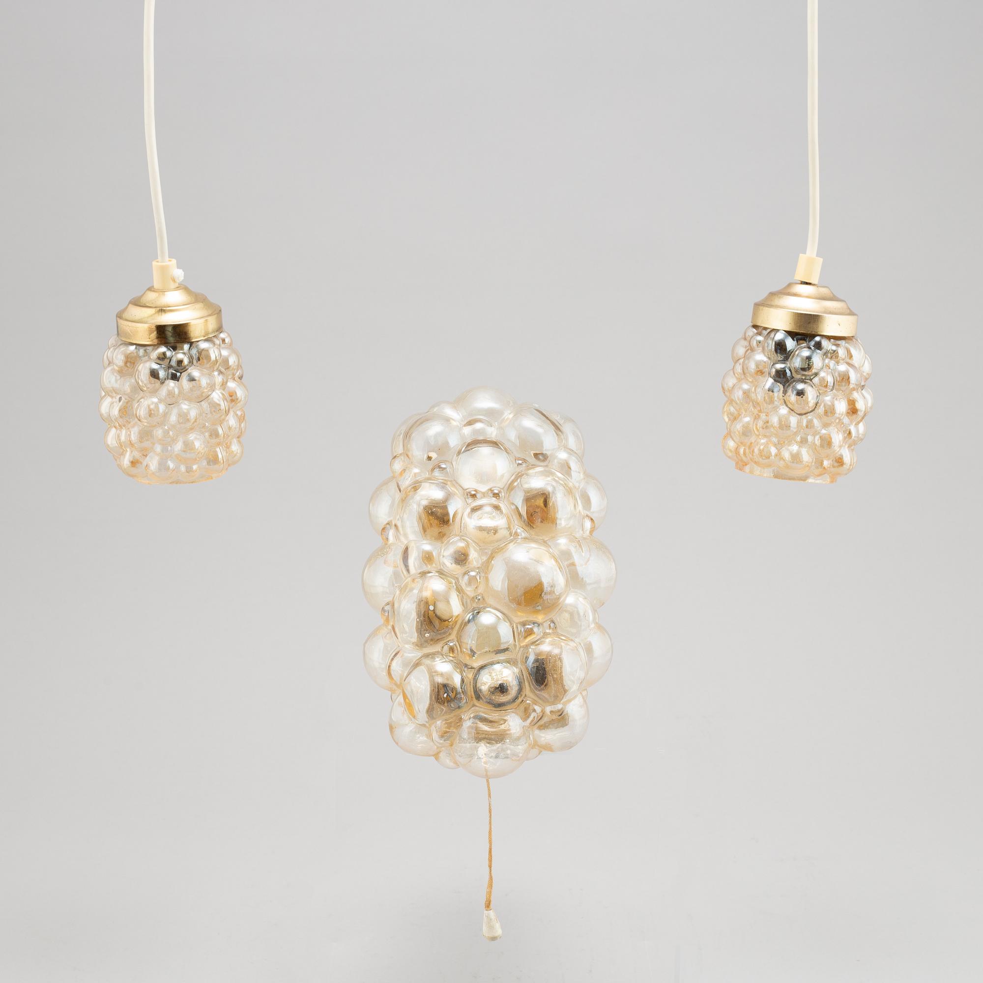 Helena Tynell, a glass wall light and a pair of ceiling lights, Glasshütte Limburg, Germany.