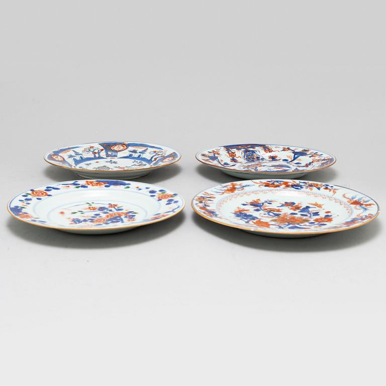 A set of eight odd imari dinner plates, Qing dynasty, 18th Century.