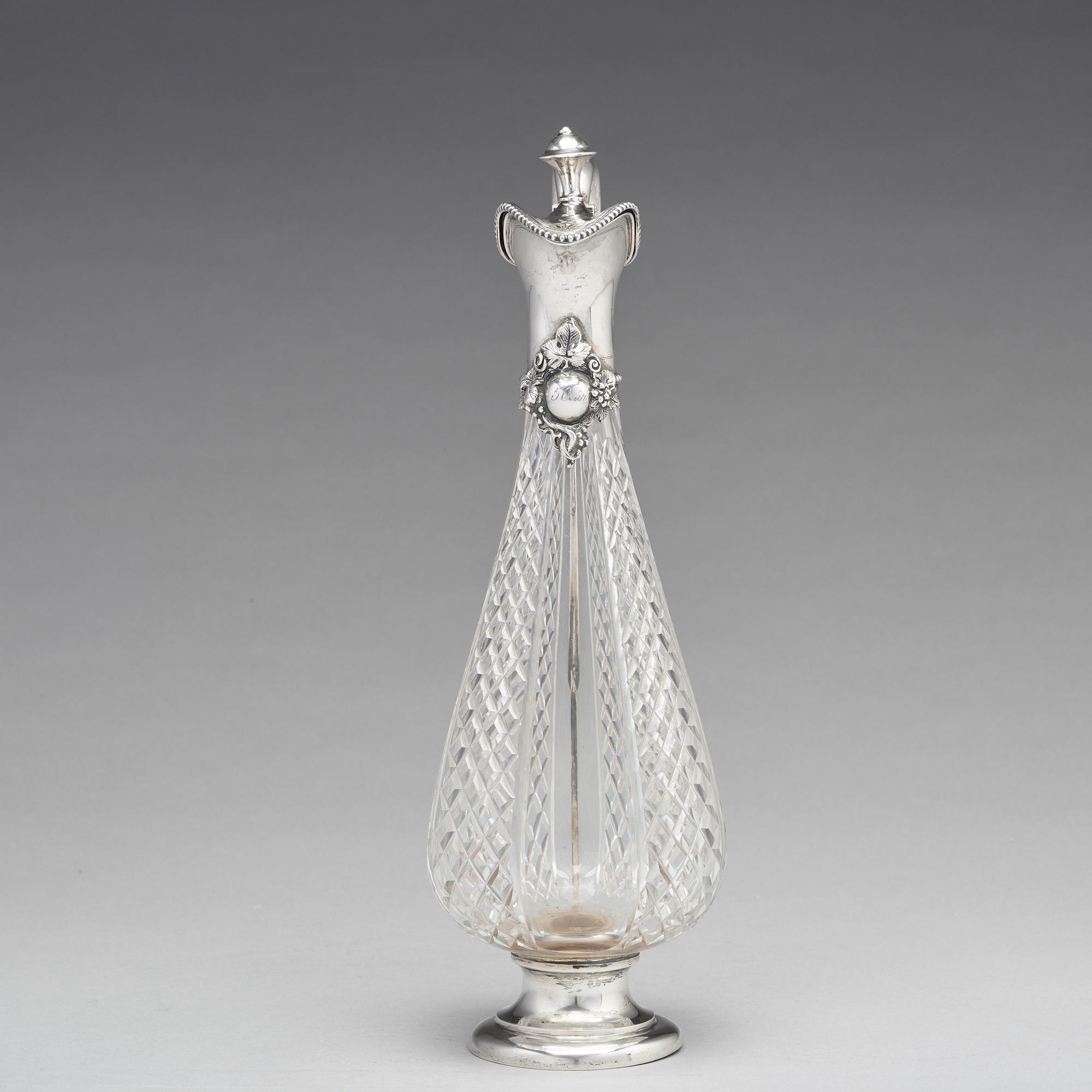 A Swedish 19th century parcel-gilt silver and glass wine-jug, mark of Lars Larsson & Co, Stockholm 1872.