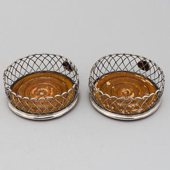 An English pair of 19th century silver plated coasters.
