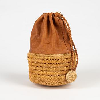 A birch root and leather bag by Ellen Kitok-Andersson.