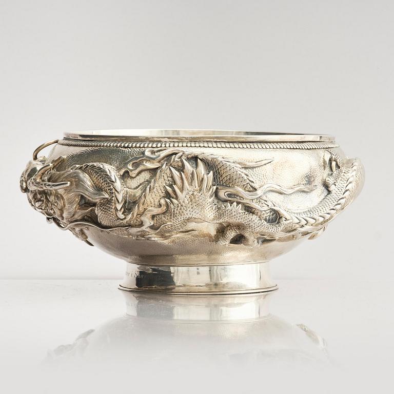 A Chinese double walled 'dragon' silver bowl, Shanghai, around 1900.