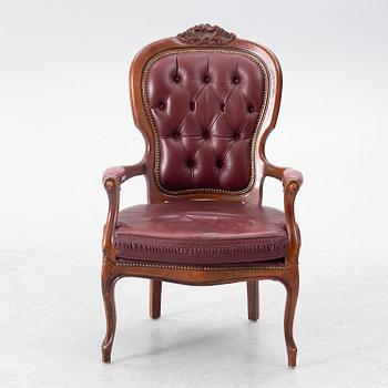 A Rococo style armchair, second half of the 20th Century.