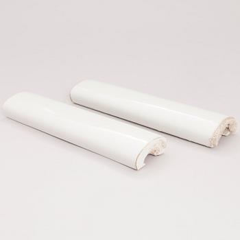 A pair of rod-shaped ceramic tiles designed by Alvar Aalto. The Alvar Aalto Museum, Finland.