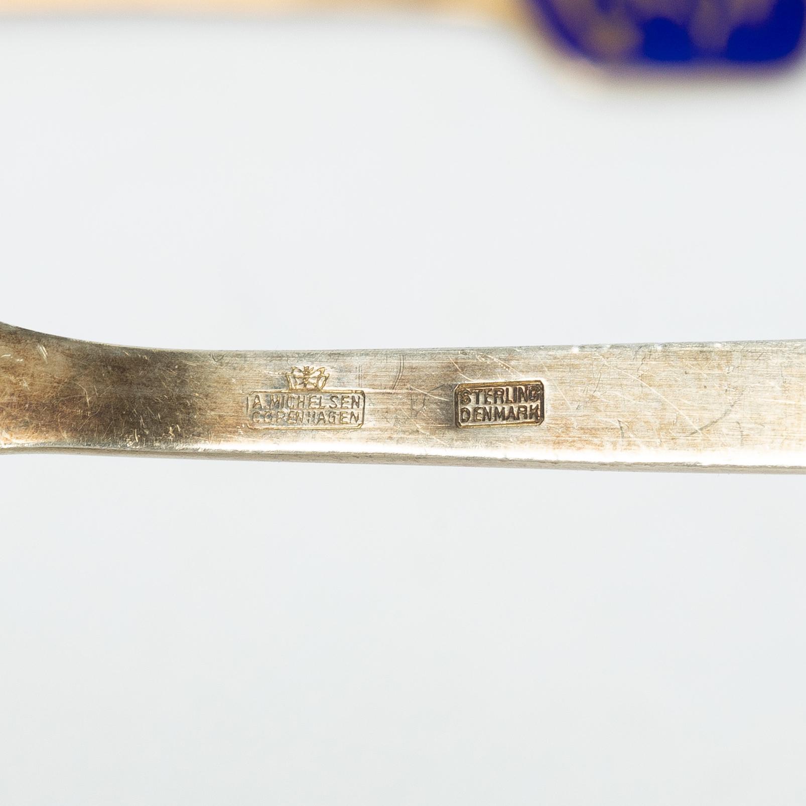 Anton Michelsen, Annual/Christmas cutlery, 8 pieces, gilt sterling silver and enamel, Denmark, 1930s–40s.
