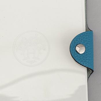 Hermès, a blue leather notebook with two scripple pads.