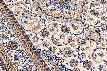 A carpet, Nain Part silk, 312 x 207 cm.