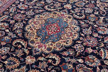 A Persian carpet, signed, c. 339 x 247 cm.