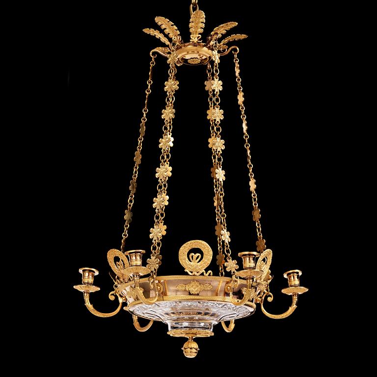 An Empire cut glass and gilded bronze six-light hanging lamp in the manner of Alexandre Guérin.