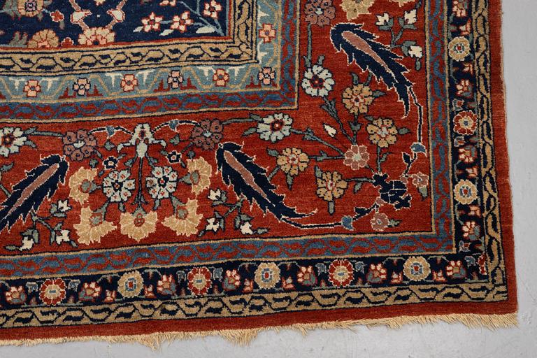 A carpet, antique Tabriz, ca 470 x 312,5 cm.