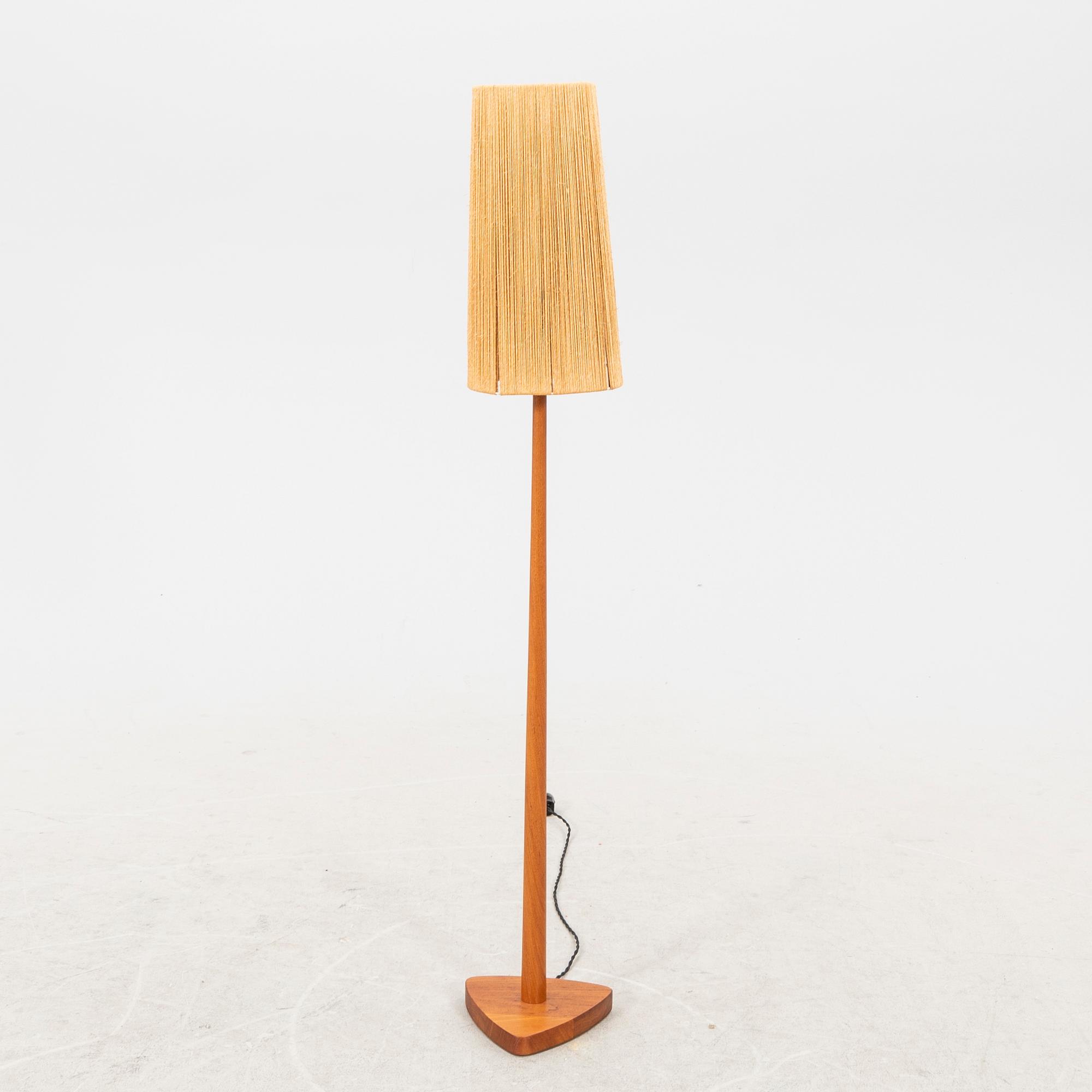 A 1940/50s teak floor lamp.