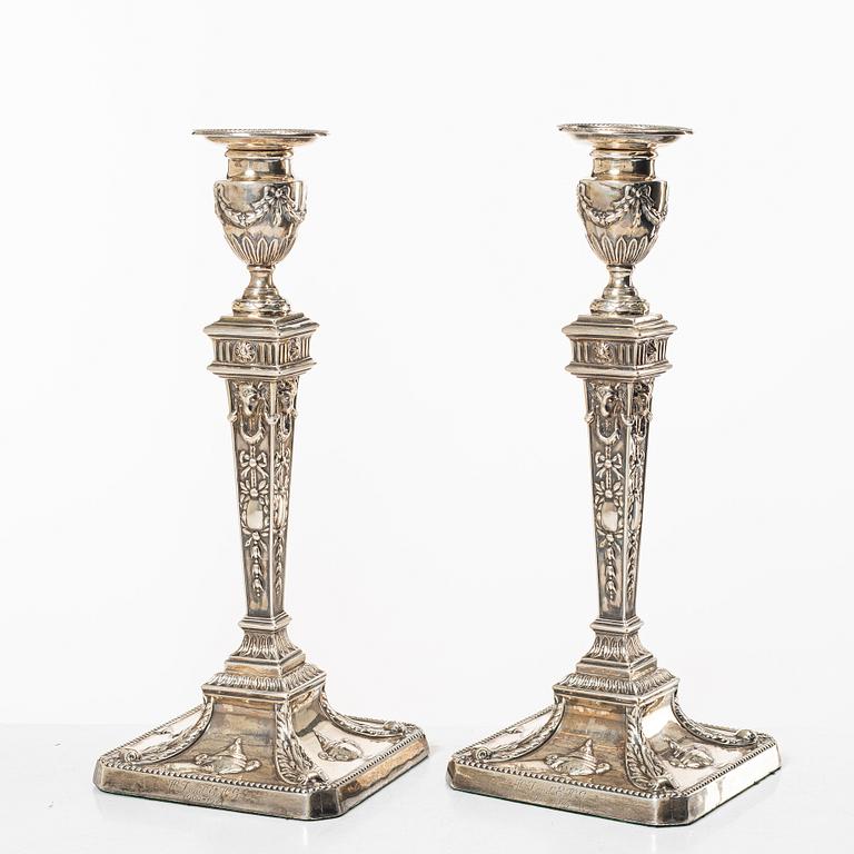 A pair of English silver candlesticks, mark of William Hutton & Sons Ltd, London 1902.