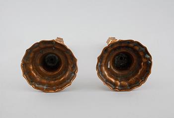 A pair of late barouqe bronze candlesticks, 18th century.