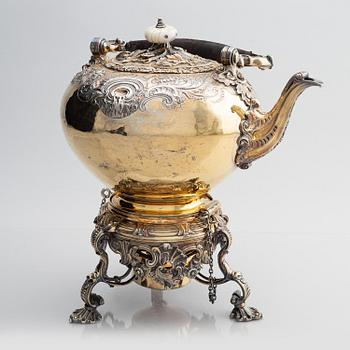 An English silver-gilt teapot with stand and burner, mark of Richard Sibley I, London 1825.