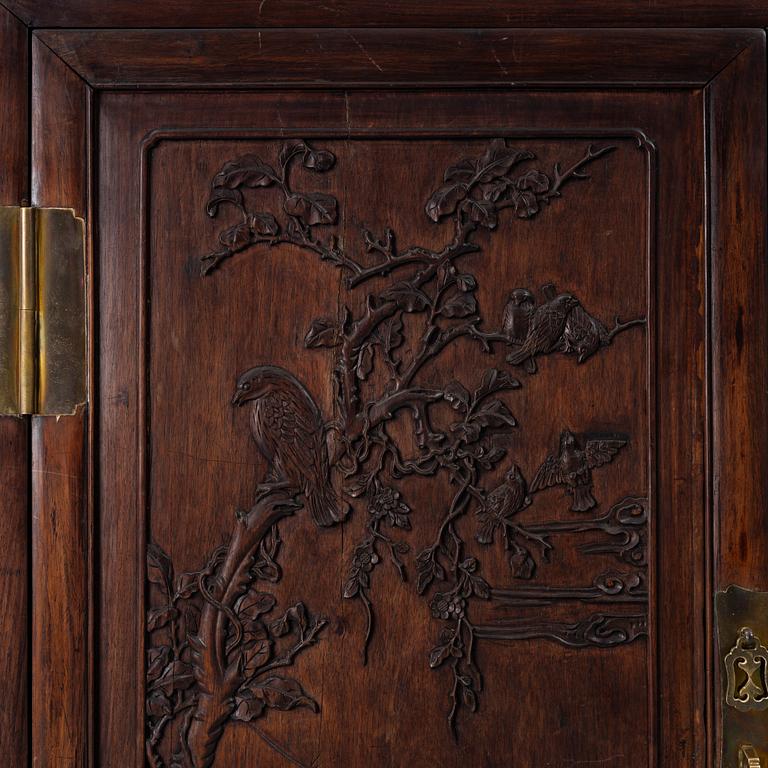 A hardwood cabinet, China, 20th century.