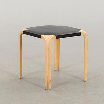 AN ALVAR AALTO "X602" STOOL by Artek.