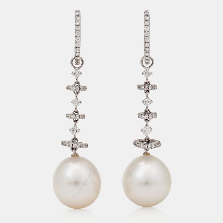 A pair of cultured South sea pearl earrings with brilliant-cut diamonds.